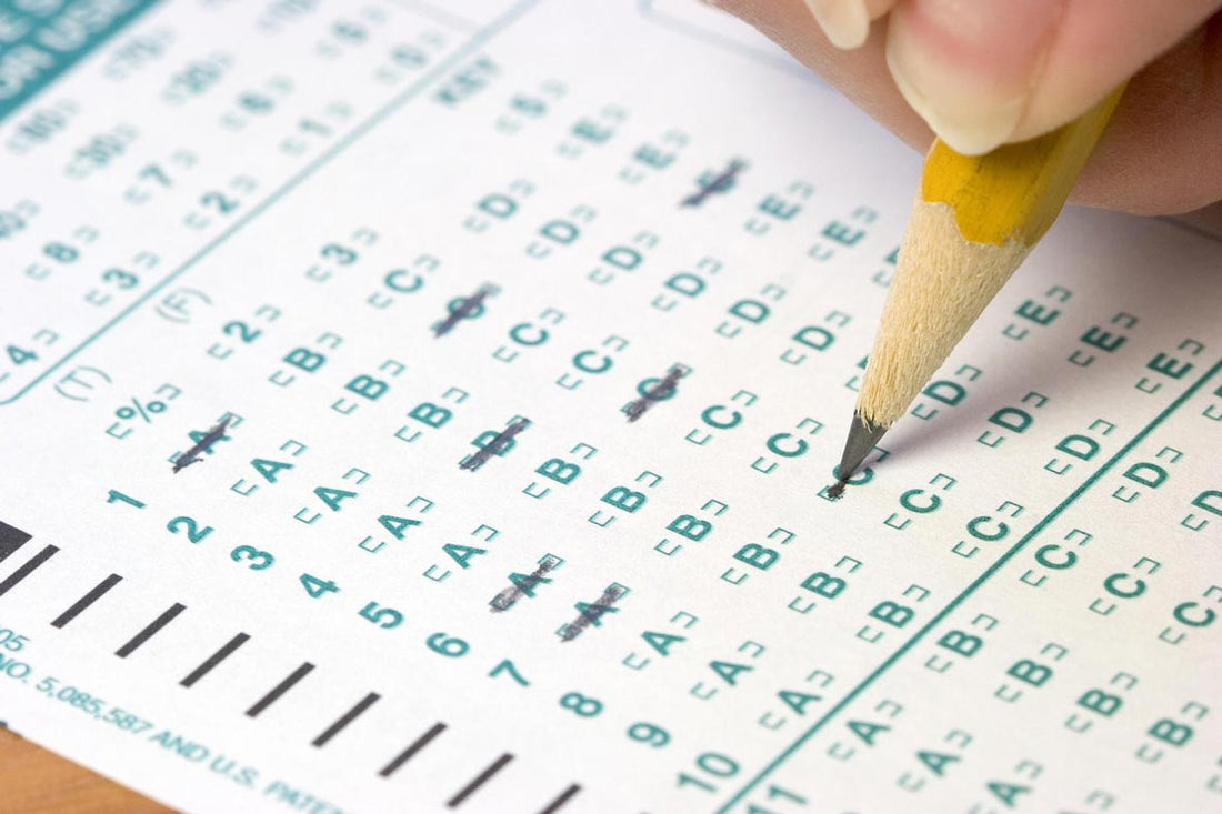 Close-up of a pencil filling in answers on a multiple-choice test sheet